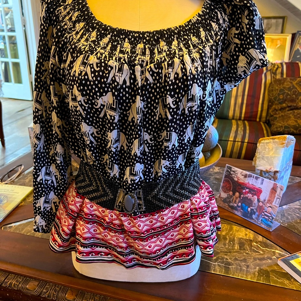 Baby doll blouse. Loose fit. Belt not included. Nice